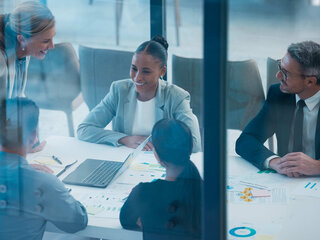 Zehnder Employees business meeting with men and women talking